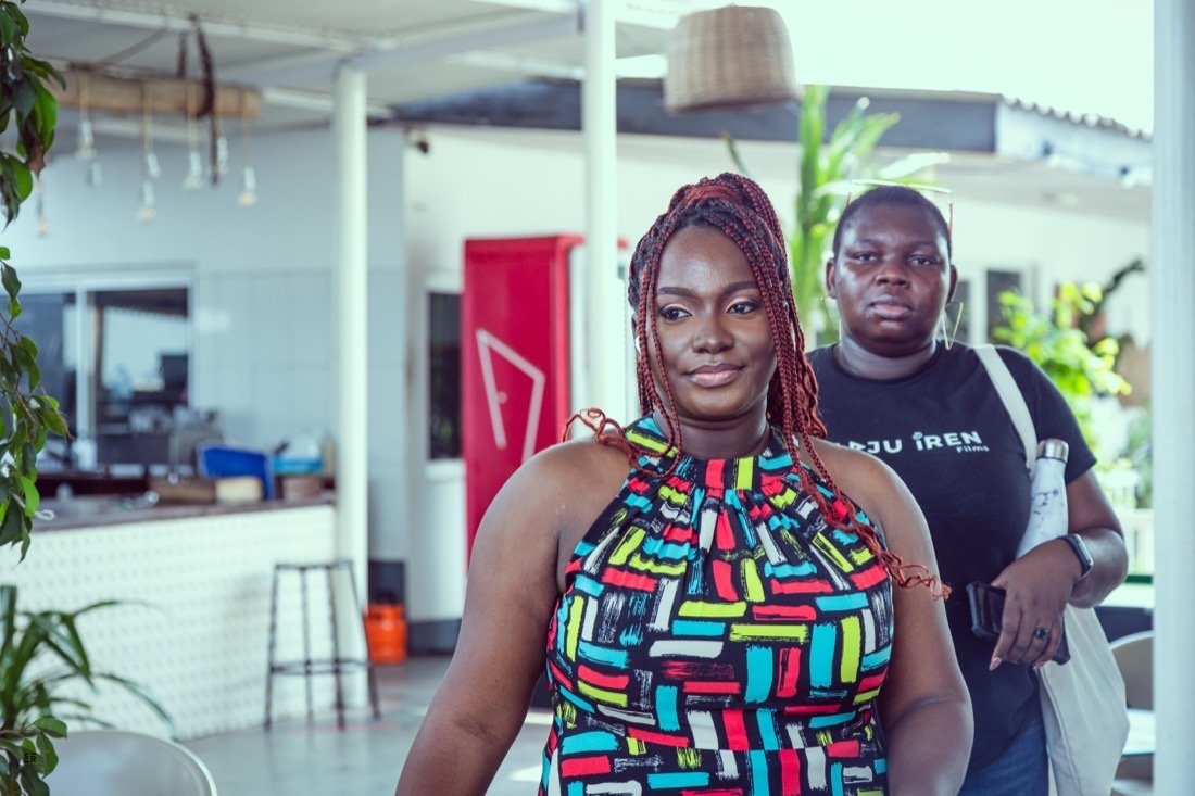 Onome on set alongside a cast member